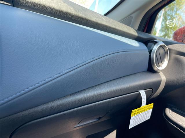 Photo of 2025 Scarlet Ember Tintcoat Nissan Versa