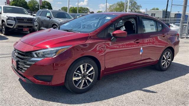 Photo of 2025 Scarlet Ember Tintcoat Nissan Versa