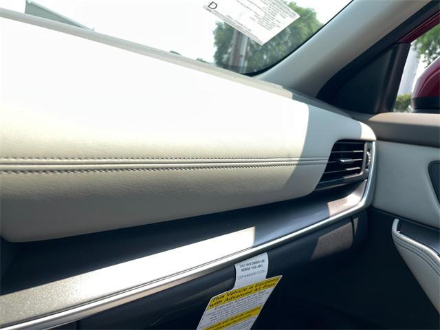 Photo of 2025 Scarlet Ember Tintcoat Nissan Rogue