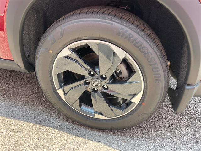 Photo of 2025 Scarlet Ember Tintcoat Nissan Rogue
