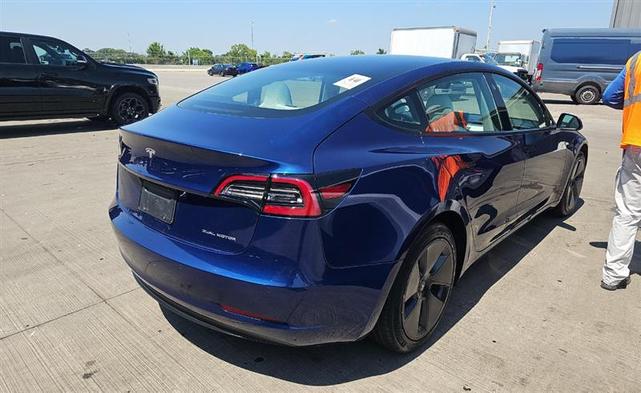 Photo of 2022 Deep Blue Metallic Tesla Model 3