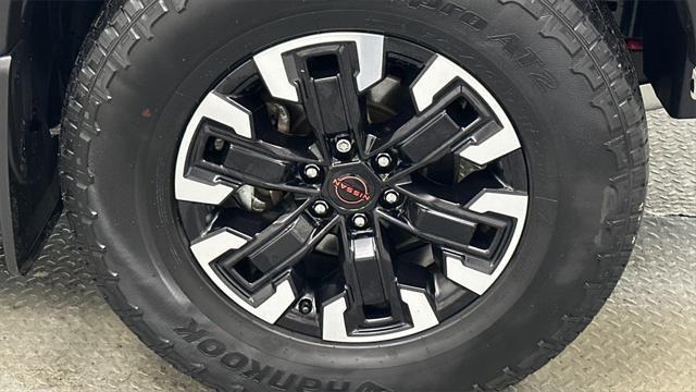 Photo of 2023 Glacier White Nissan Frontier