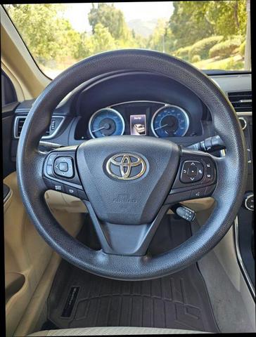 Photo of 2015 Black Toyota Camry Hybrid