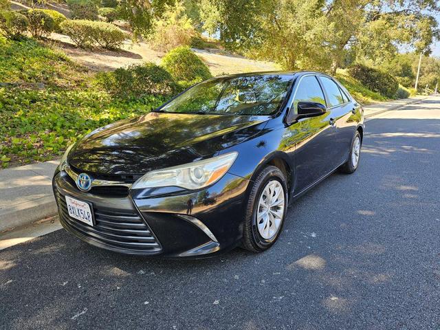 Photo of 2015 Black Toyota Camry Hybrid