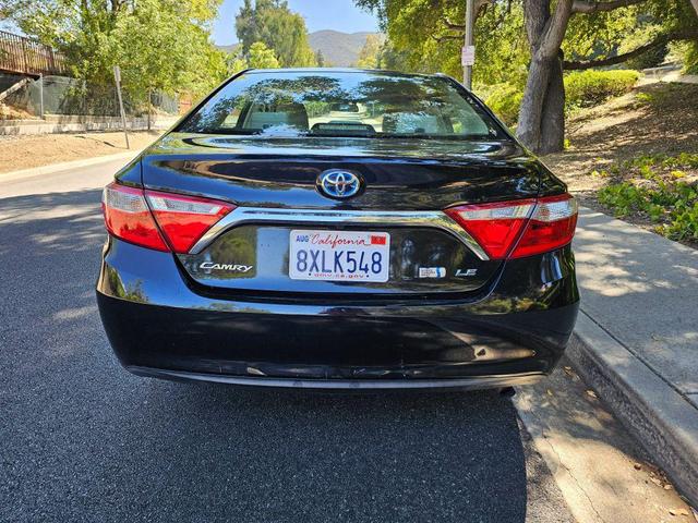 Photo of 2015 Black Toyota Camry Hybrid