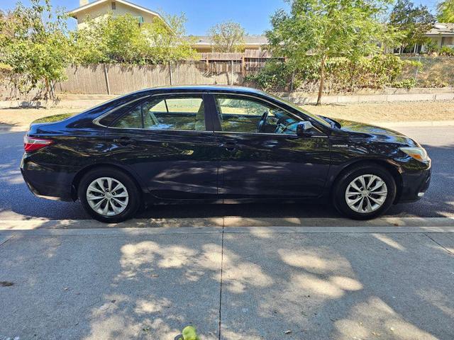 Photo of 2015 Black Toyota Camry Hybrid