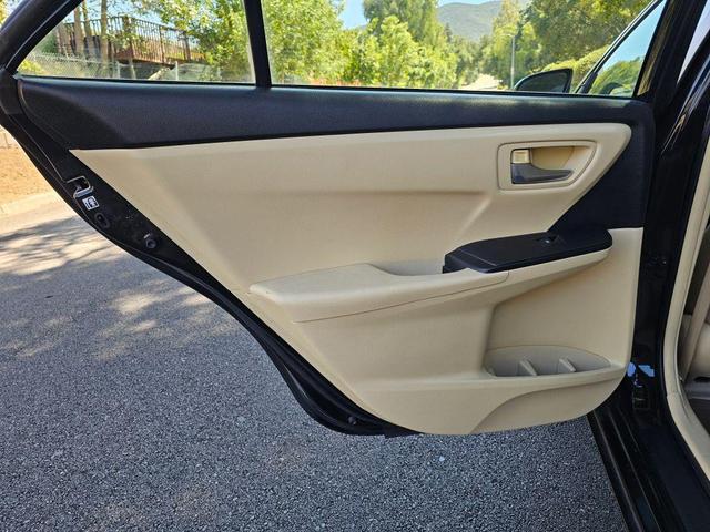 Photo of 2015 Black Toyota Camry Hybrid