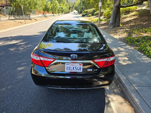 Photo of 2015 Black Toyota Camry Hybrid