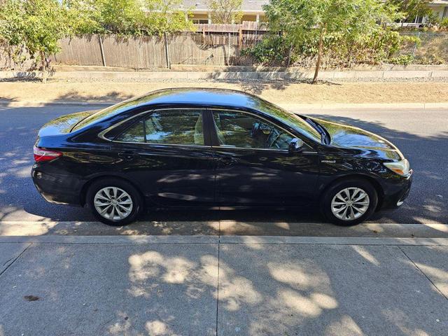 Photo of 2015 Black Toyota Camry Hybrid