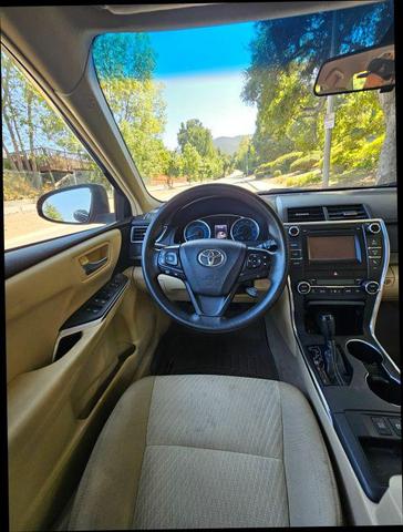 Photo of 2015 Black Toyota Camry Hybrid
