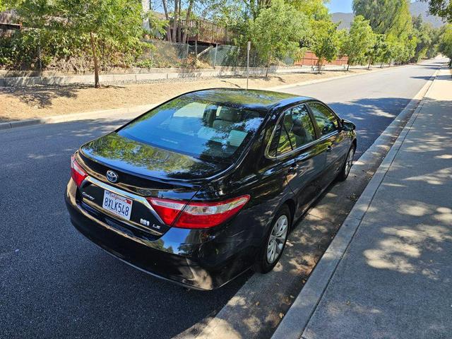 Photo of 2015 Black Toyota Camry Hybrid