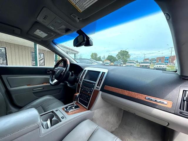 Photo of 2011 Crystal Red Tintcoat Cadillac STS