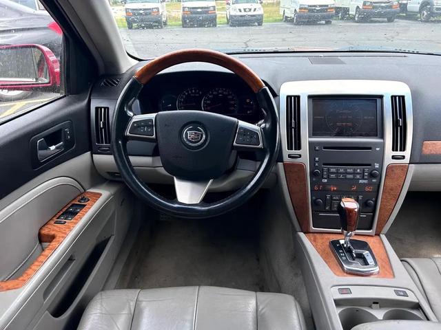 Photo of 2011 Crystal Red Tintcoat Cadillac STS