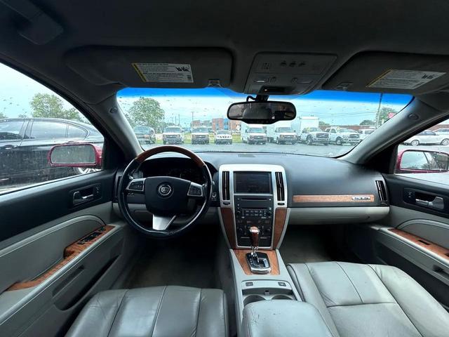 Photo of 2011 Crystal Red Tintcoat Cadillac STS