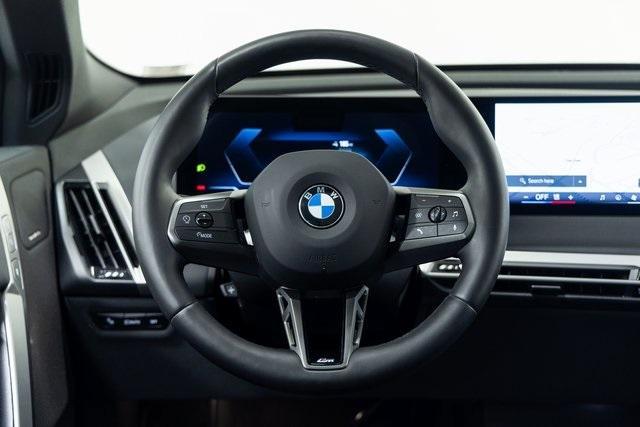 Photo of 2025 Black Sapphire Metallic BMW iX