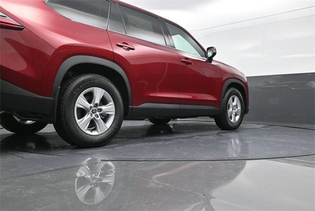 Photo of 2025 Ruby Flare Pearl Toyota Highlander Hybrid