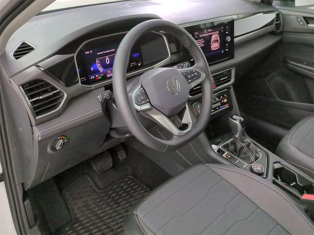 Photo of 2025 Pure White w/Deep Black Roof Volkswagen Taos