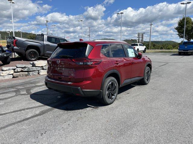 Photo of 2026 Scarlet Ember Tintcoat Nissan Rogue