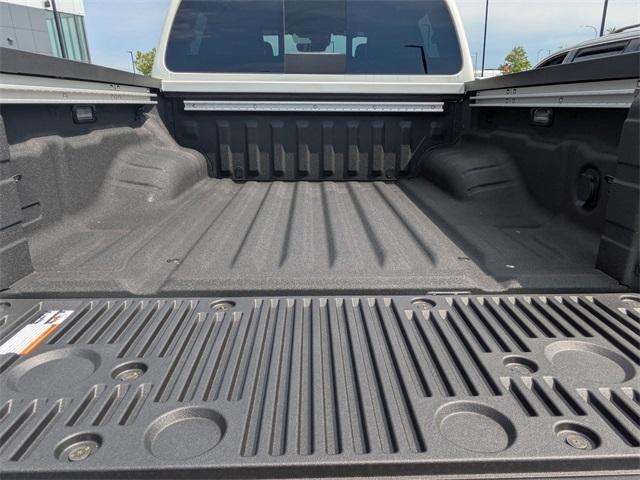 Photo of 2025 Glacier White Nissan Frontier