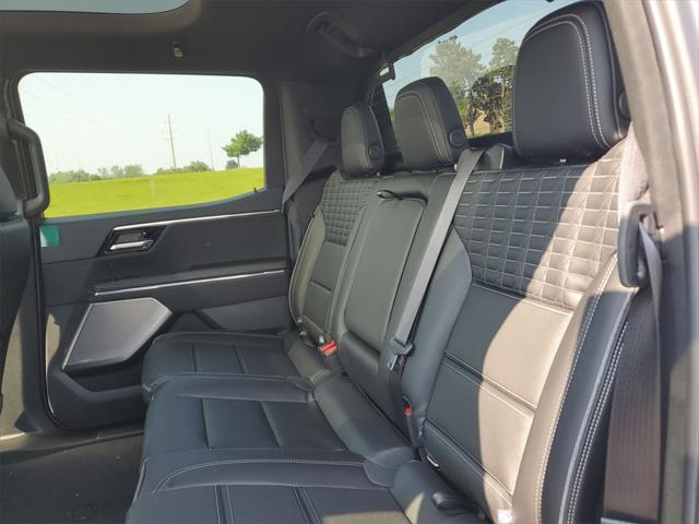 Photo of 2025 Summit White GMC Sierra EV