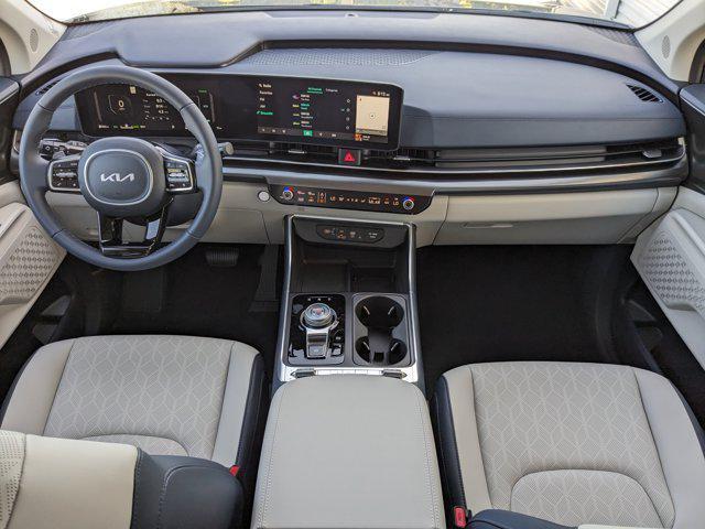 Photo of 2026 Ceramic White Kia Carnival Hybrid