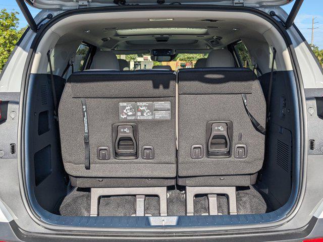 Photo of 2026 Ceramic White Kia Carnival Hybrid