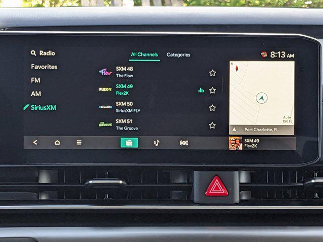 Photo of 2026 Ceramic White Kia Carnival Hybrid