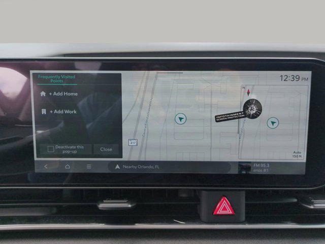 Photo of 2026 Flare Red Kia Carnival Hybrid