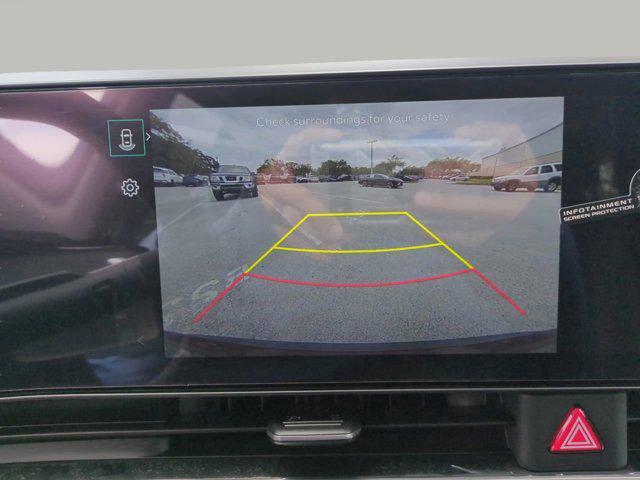 Photo of 2026 Flare Red Kia Carnival Hybrid