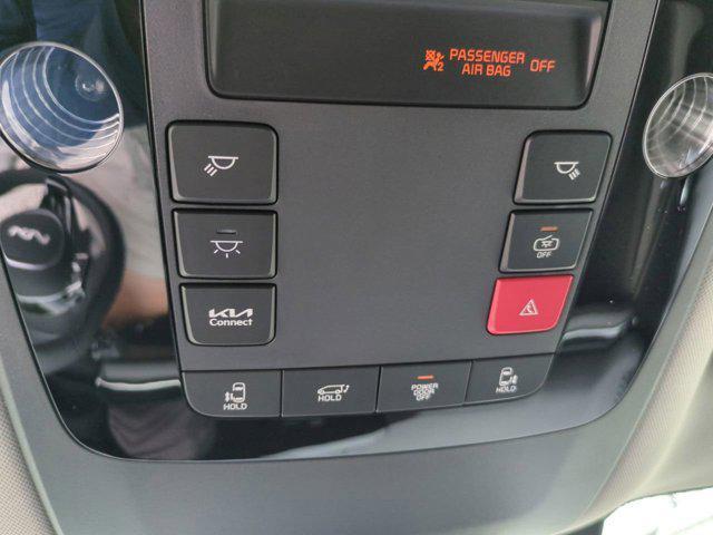 Photo of 2026 Flare Red Kia Carnival Hybrid