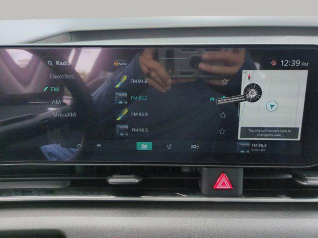 Photo of 2026 Flare Red Kia Carnival Hybrid