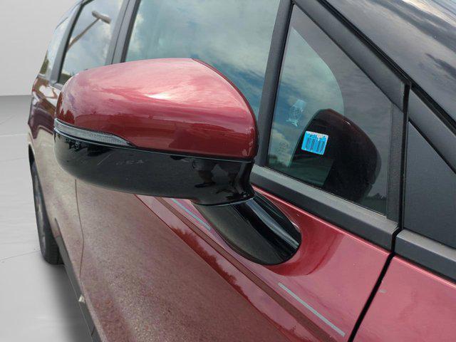 Photo of 2026 Flare Red Kia Carnival Hybrid