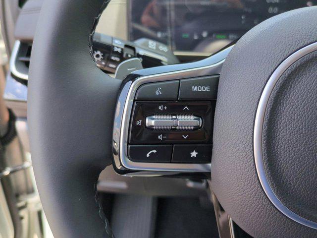 Photo of 2025 Ivory Silver Kia Carnival Hybrid