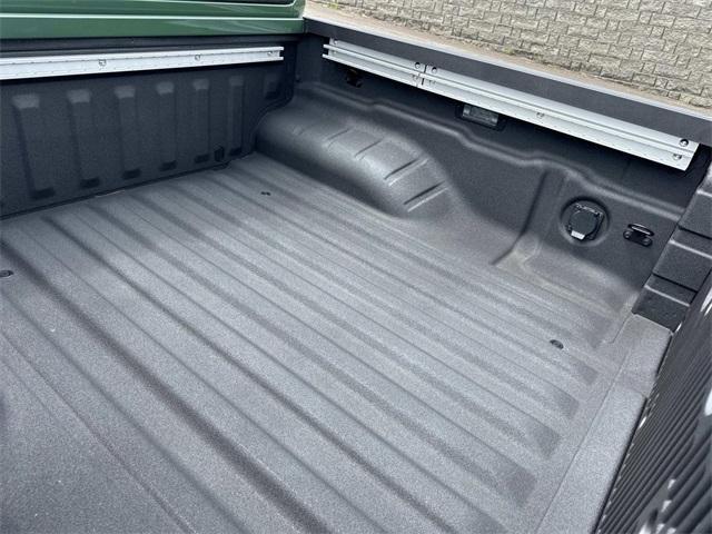 Photo of 2025 Tactical Green Nissan Frontier
