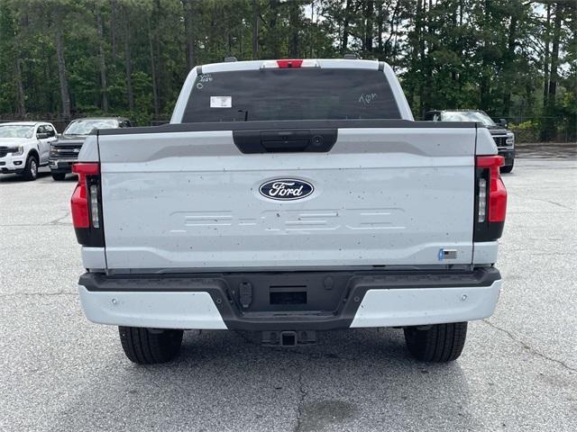 Photo of 2025 White Metallic Ford F-150 Lightning