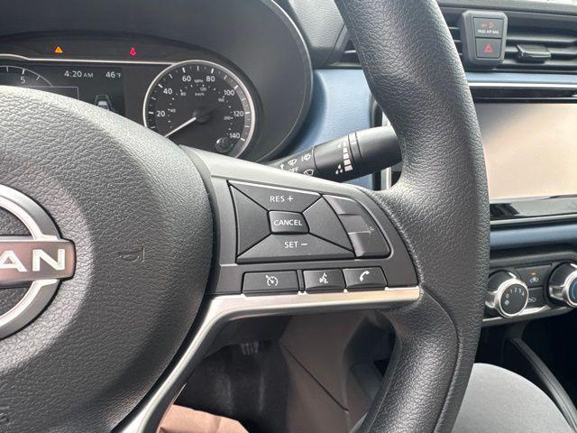Photo of 2025 Aspen White Tricoat Nissan Versa