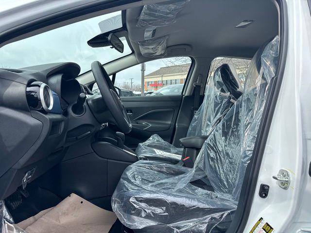 Photo of 2025 Aspen White Tricoat Nissan Versa