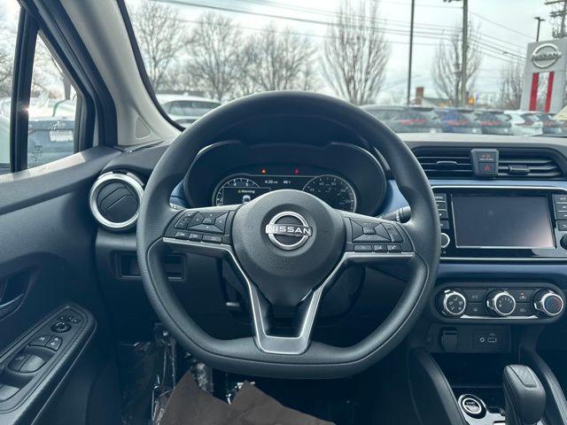 Photo of 2025 Aspen White Tricoat Nissan Versa