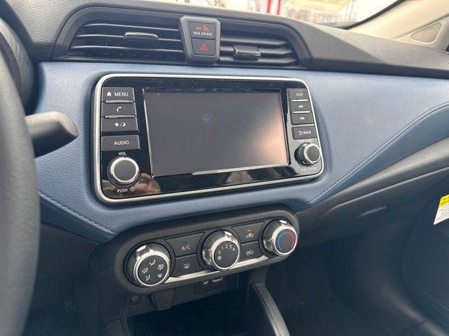 Photo of 2025 Aspen White Tricoat Nissan Versa