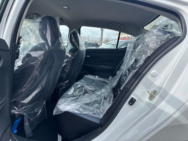 Photo of 2025 Aspen White Tricoat Nissan Versa