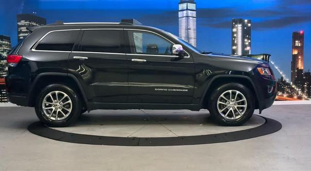 Photo of 2015 Black Forest Green Pearlcoat Jeep Grand Cherokee