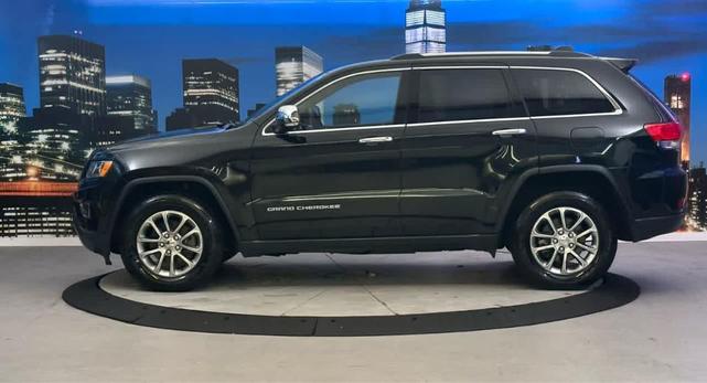 Photo of 2015 Black Forest Green Pearlcoat Jeep Grand Cherokee