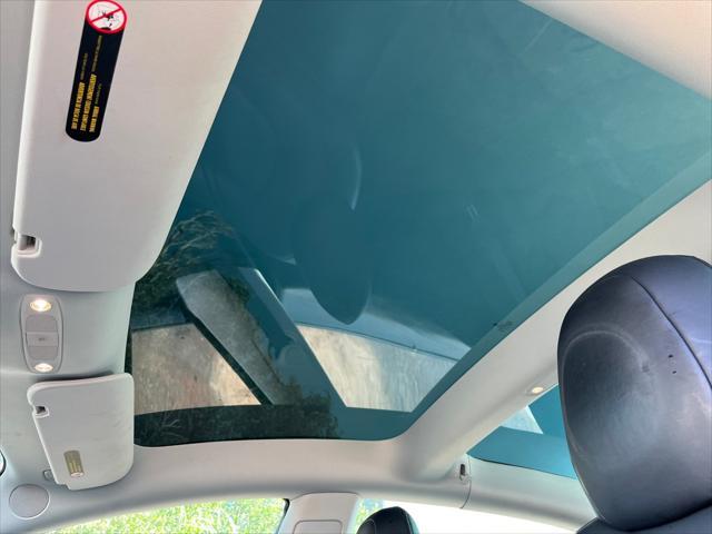 Photo of 2021 Pearl White Multi-Coat Tesla Model 3
