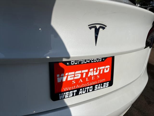 Photo of 2021 Pearl White Multi-Coat Tesla Model 3