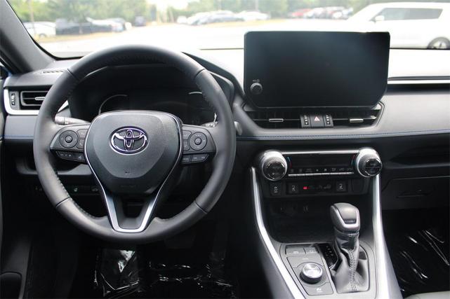 Photo of 2024 Cavalry Blue/Midnight Black Metallic Toyota RAV4 Hybrid