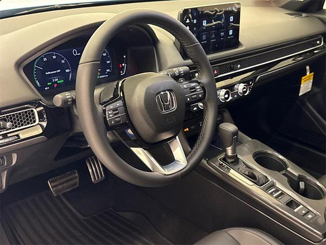 Photo of 2025 Boost Blue Pearl Honda Civic Hybrid