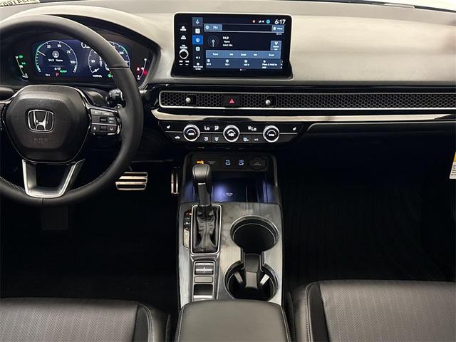 Photo of 2025 Solar Silver Metallic Honda Civic Hybrid