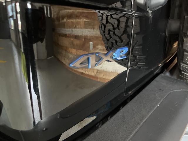 Photo of 2022 Black Clearcoat Jeep Wrangler Unlimited 4xe