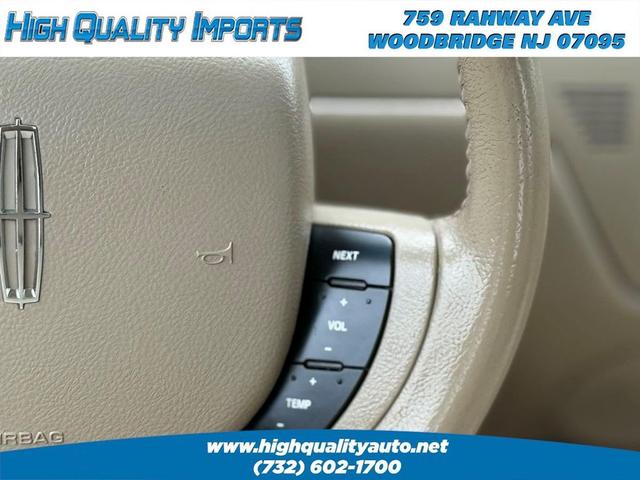Photo of 2008 Light French Silk Metallic Lincoln Town Car