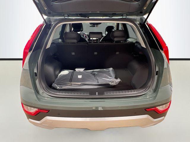 Photo of 2025 Cityscape Green Kia Niro Plug-In Hybrid